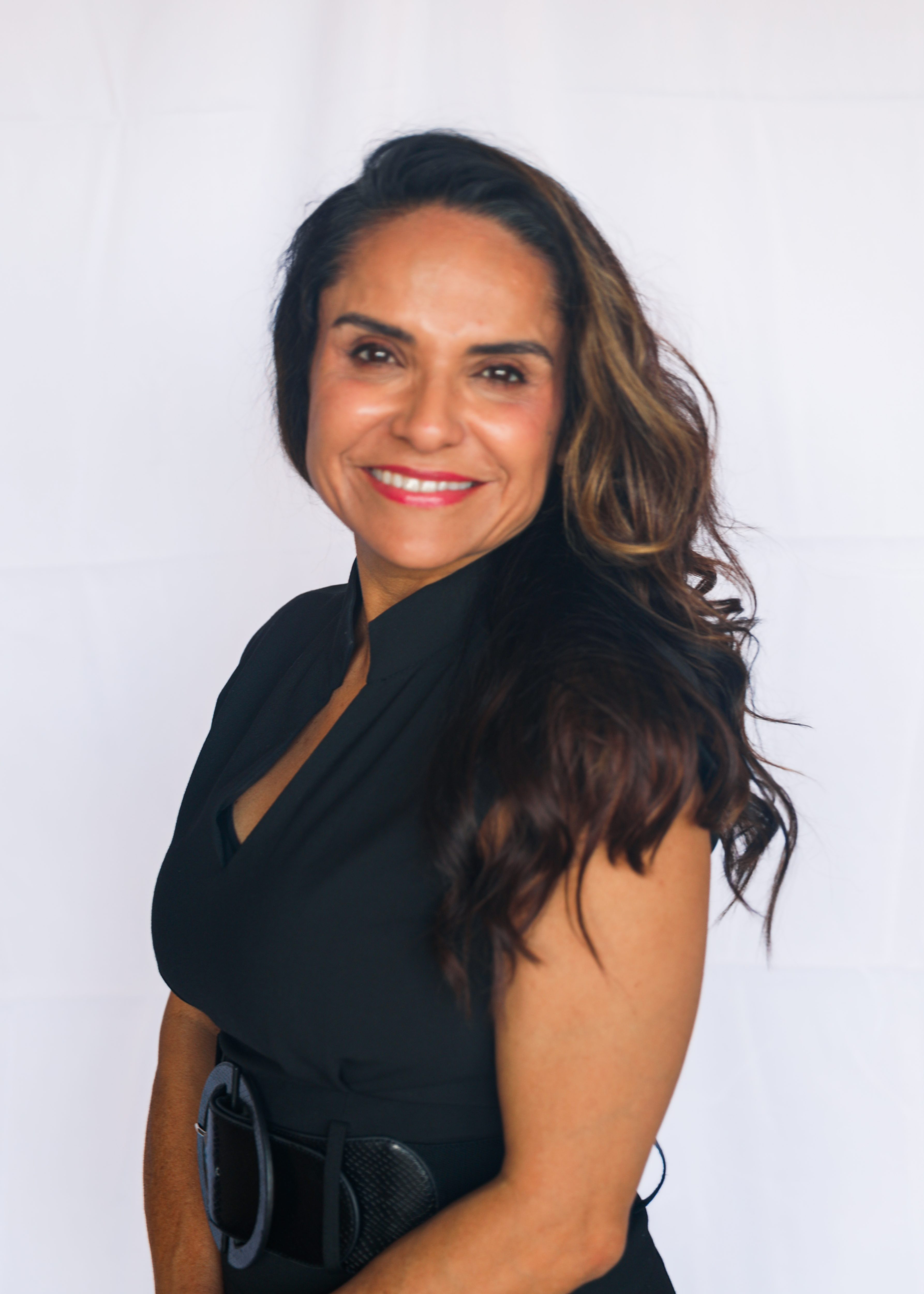 aesthetics doctor smiling wearing black dress